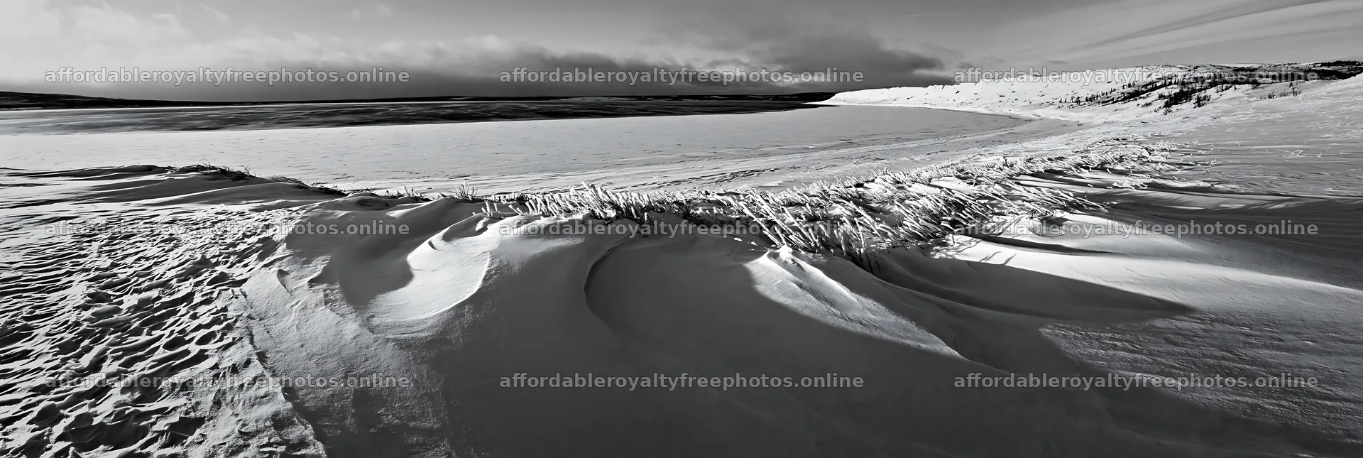 Snowy lakeside meadow with ice and snow formations – royalty-free photos 13690x4602