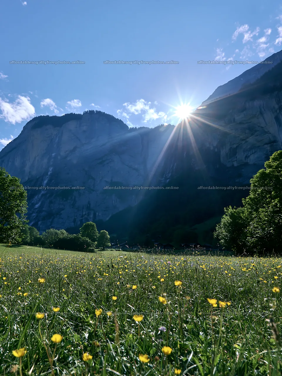 Lauterbrunnen Valley meadow light rays shine over the – royalty-free photos 6866x9174