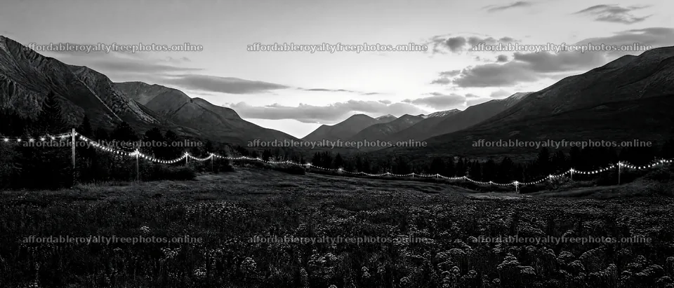 Warm Christmas lights in a mountain valley meadow – royalty-free photos 12124x5196