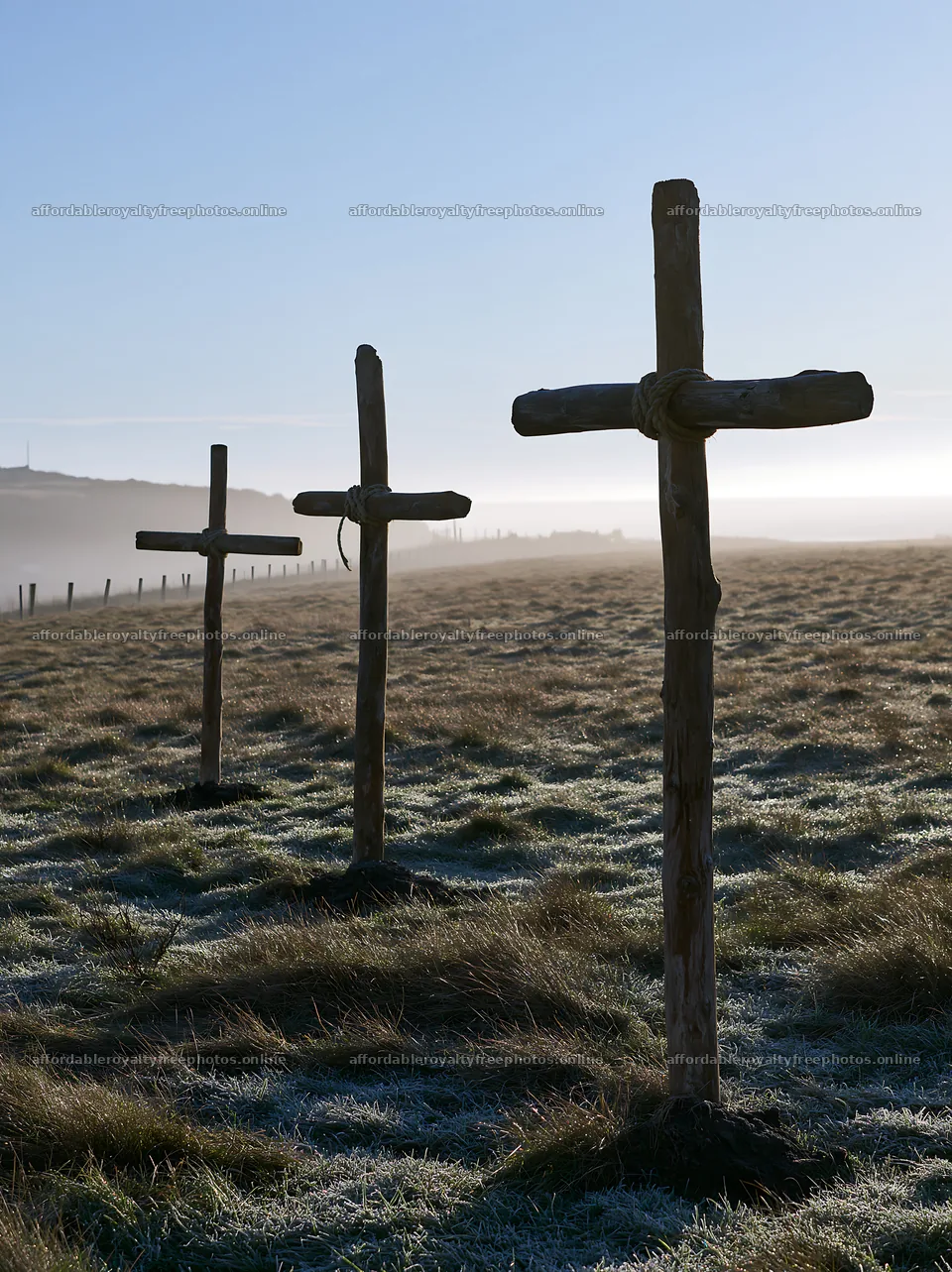 Rustic crosses in a Christmas meadow at dawn – royalty-free photos 6866x9174