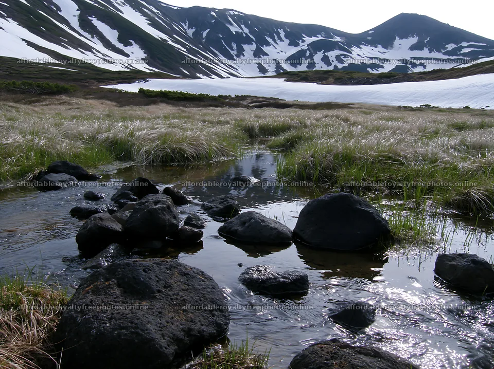 Akita snowmelt meadow with silver grasses and flowing – royalty-free photos 9174x6866