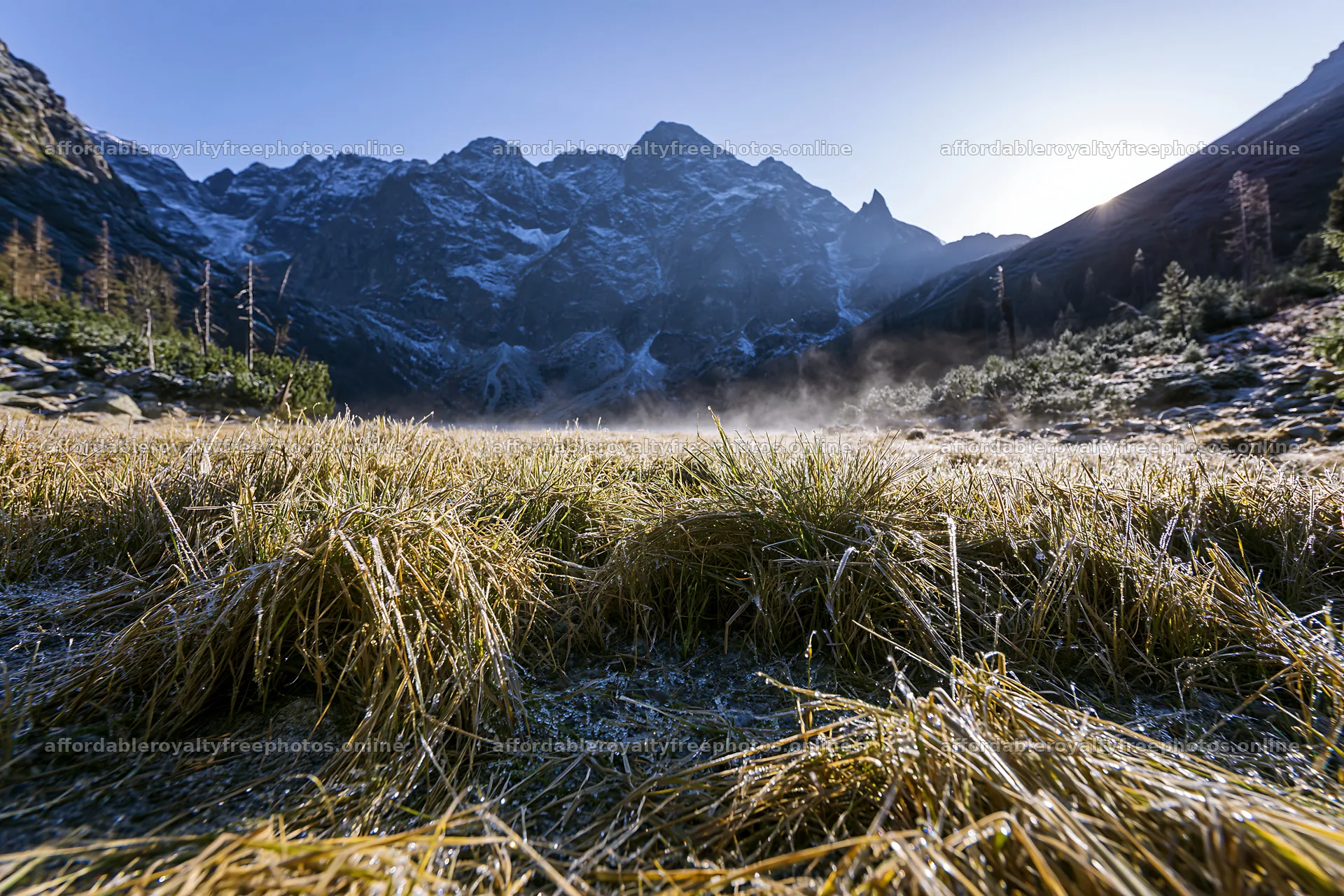 Meadow in a rolling valley with mountains under morning – royalty-free photos 9722x6480