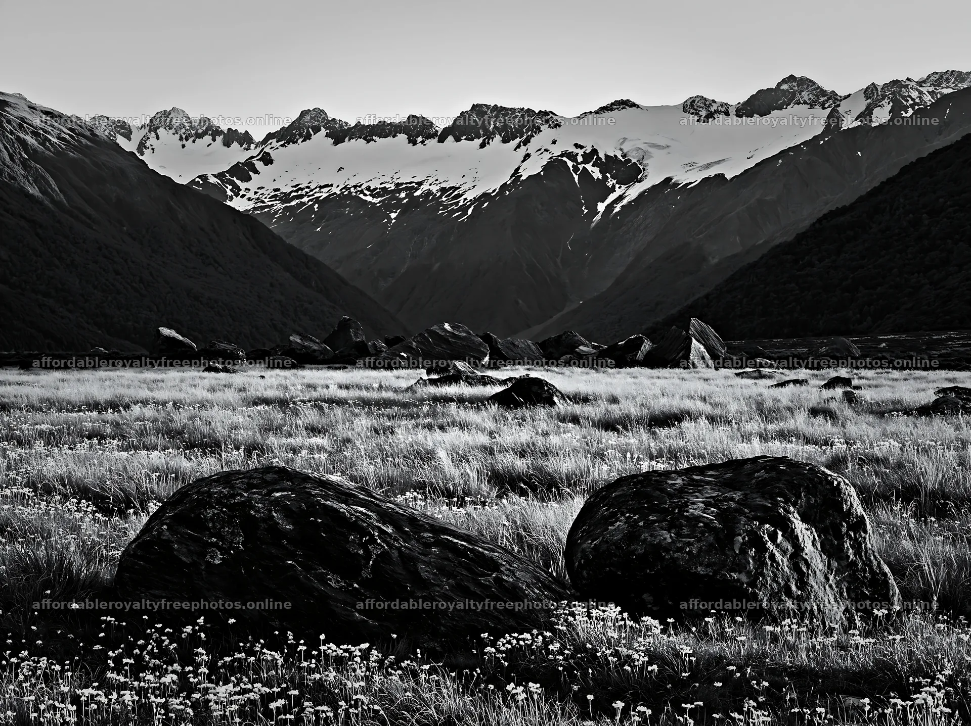 Meadow with boulders and mountains in the background – royalty-free photos 9174x6866