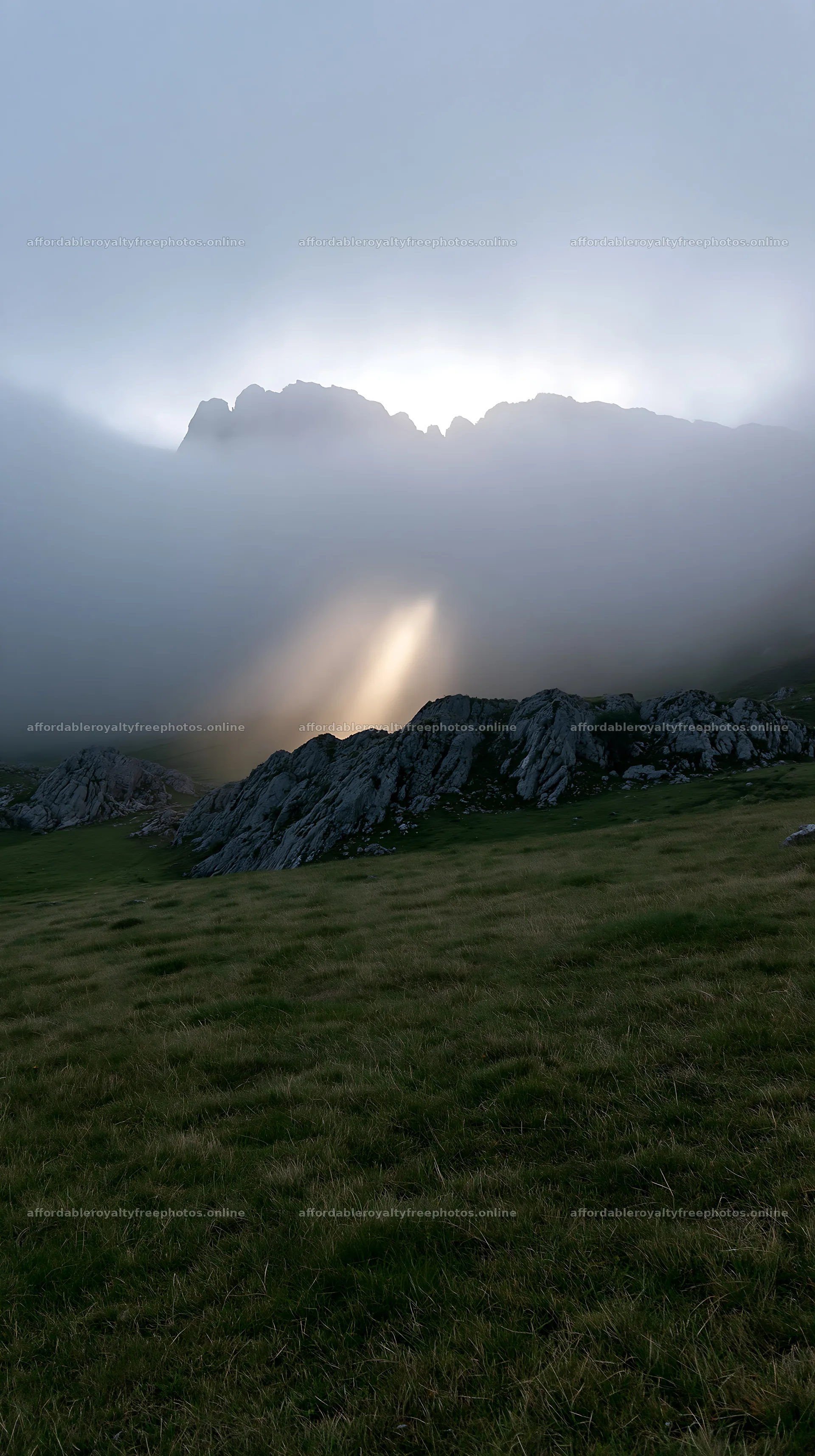 Sunrays shining through fog in Picos de Europa meadow – royalty-free photos 5938x10608