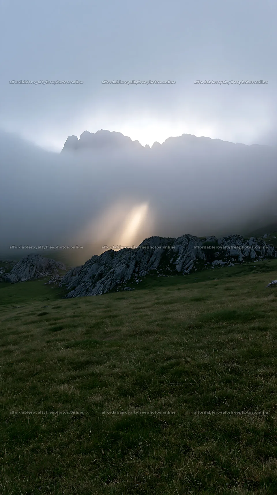 Sunrays shining through fog in Picos de Europa meadow – royalty-free photos 5938x10608