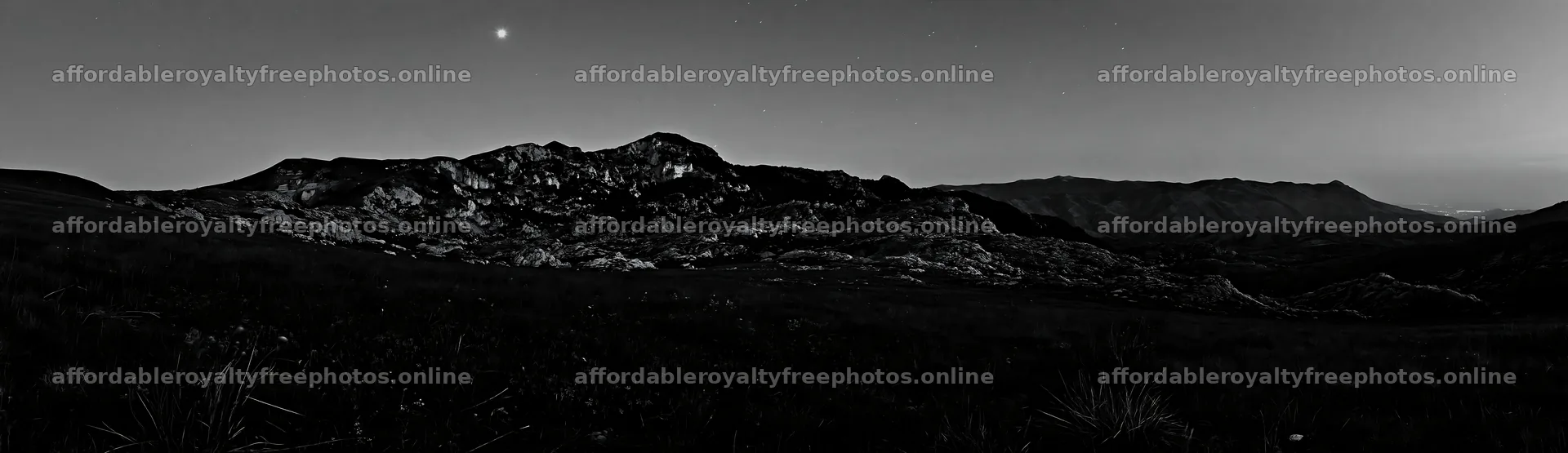 Starlit meadow under dark sky in a mountainous region – royalty-free photos 14762x4268