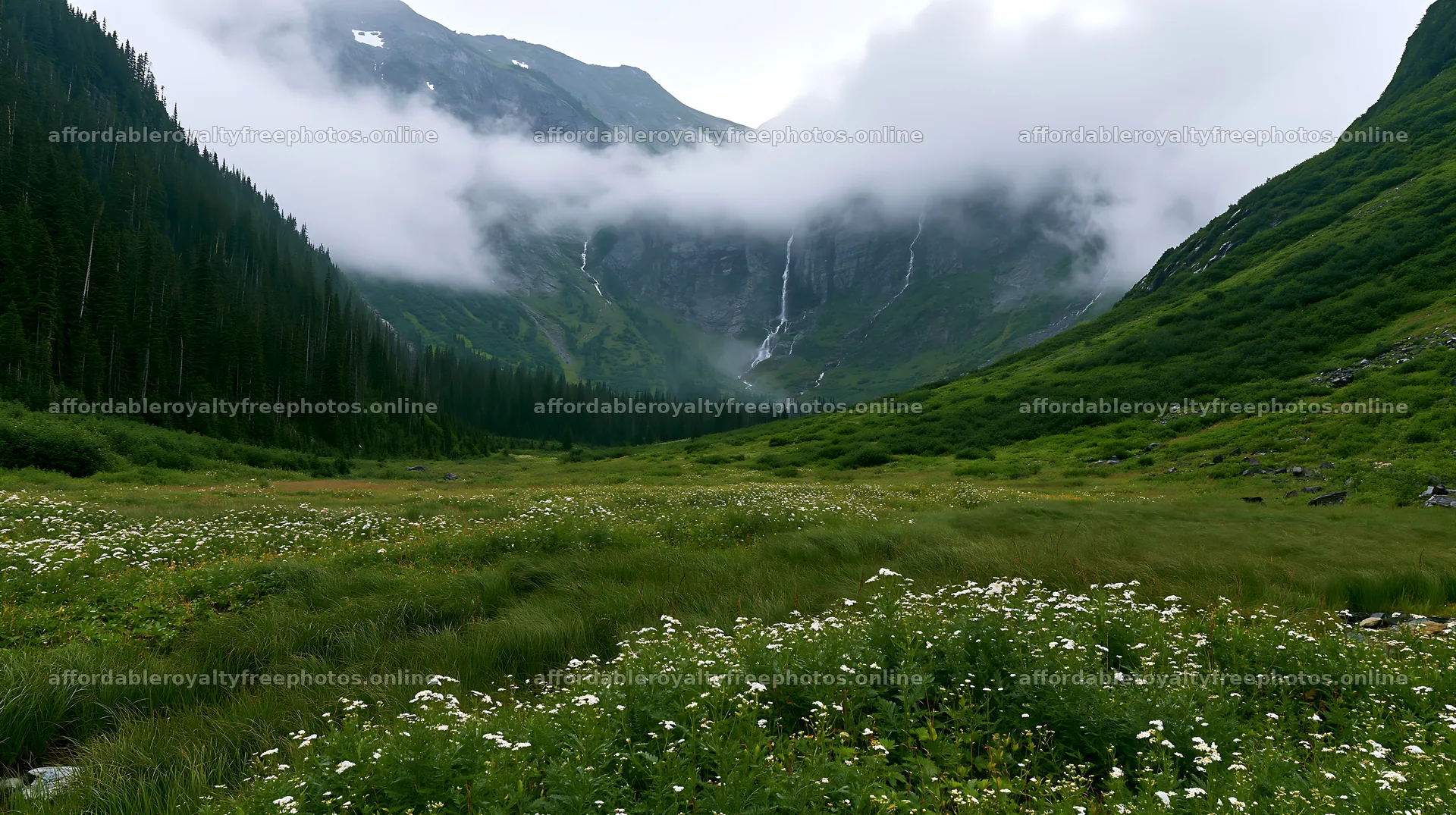 Misty mountains and waterfall in a green meadow – royalty-free photos 10608x5938