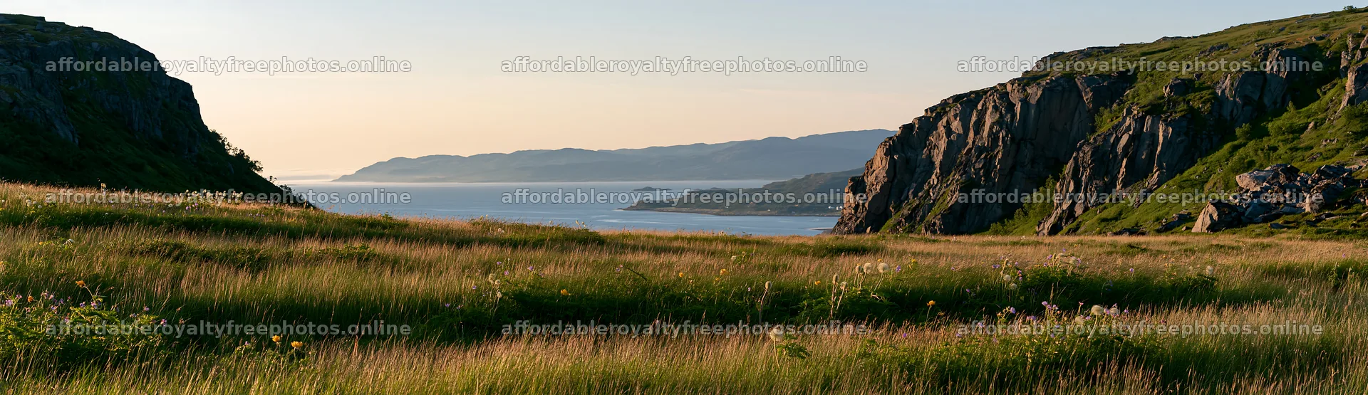 Meadow beneath crags with ocean view at sunset – royalty-free photos 14762x4268