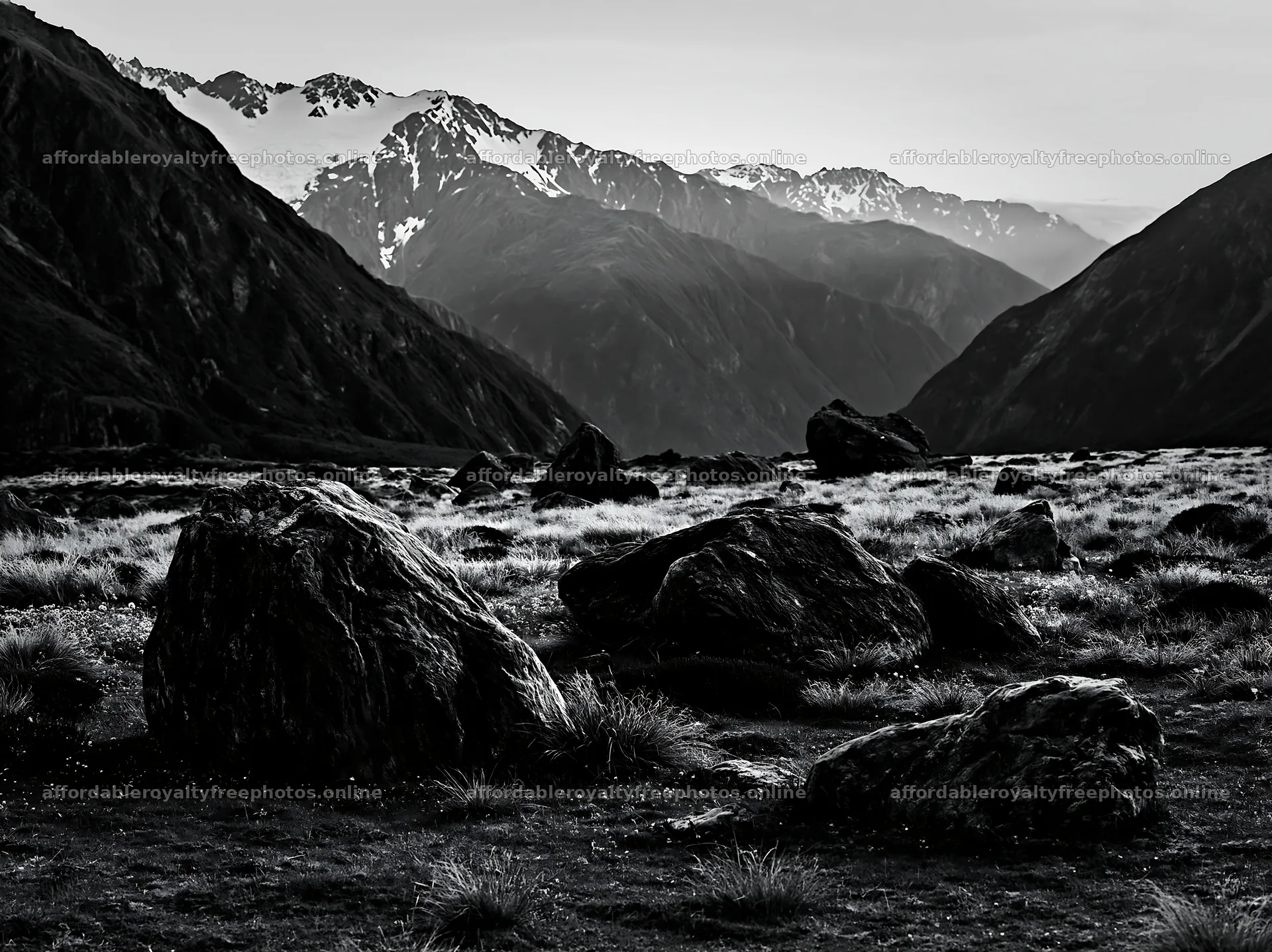 Meadow with boulders and mountains in the background – royalty-free photos 9174x6866