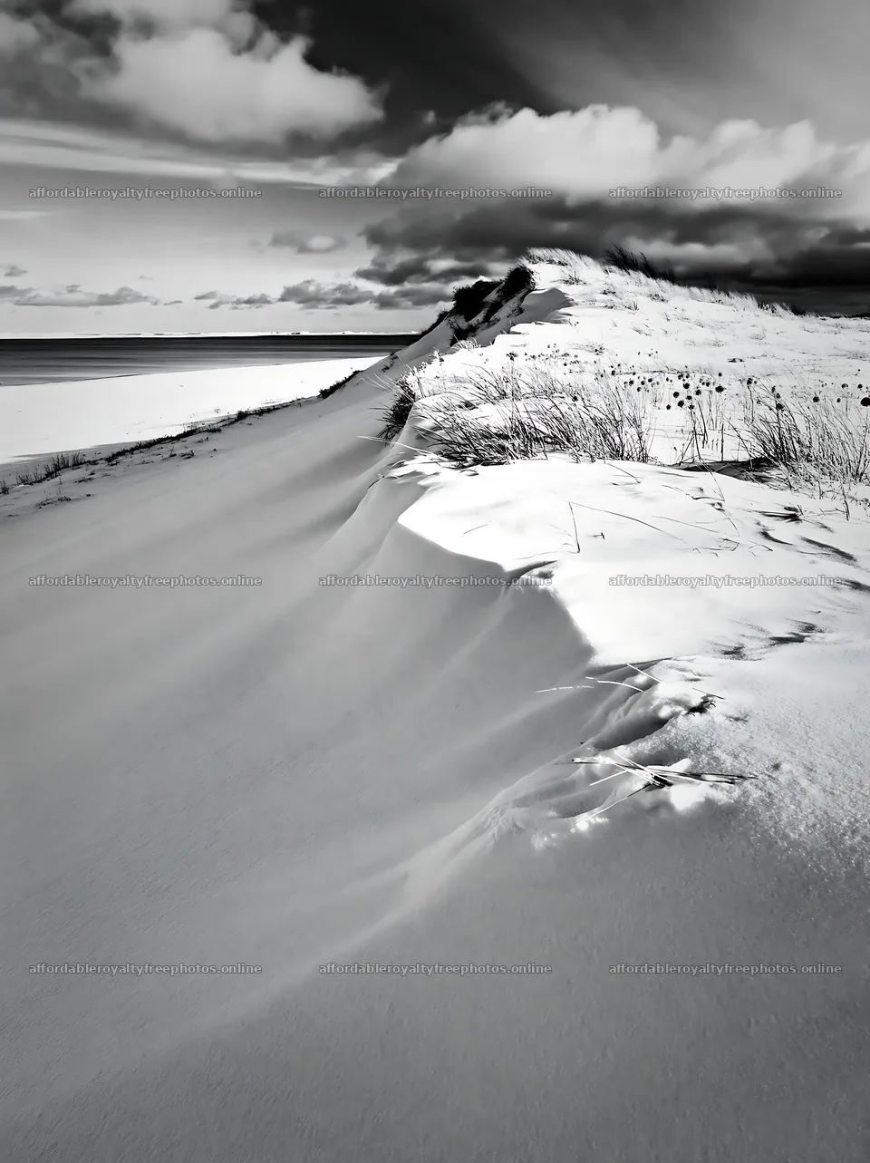 Dune meadow covered in snow by the water – royalty-free photos 6866x9174